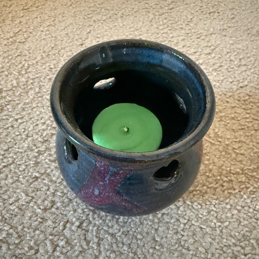 Handcrafted Ceramic Candle Holder with Heart Shaped Cutouts and Green Candle